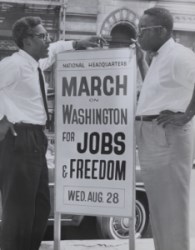 37E98BE1-1DD8-B71B-0B2D70738F98BF50 two black men next to a sign that reads march on washington for jobs and freedom